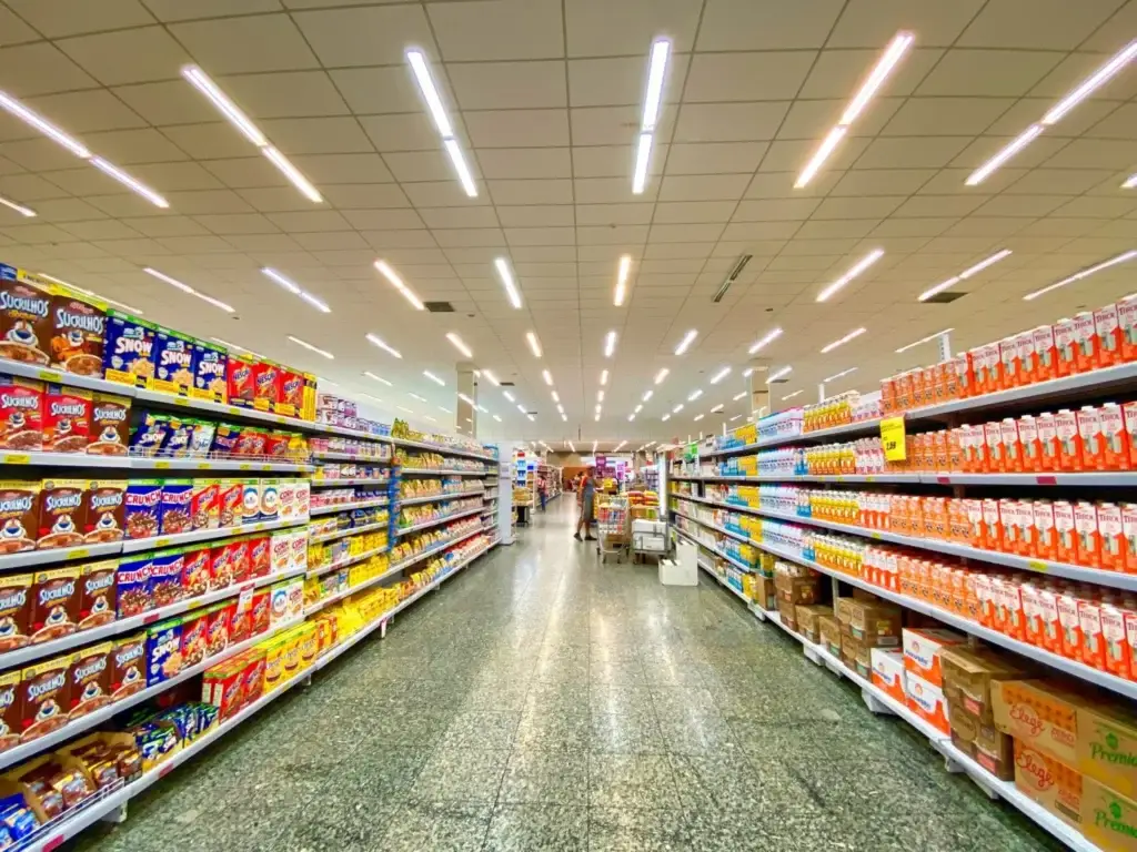 the grocery store hallway with woman buying